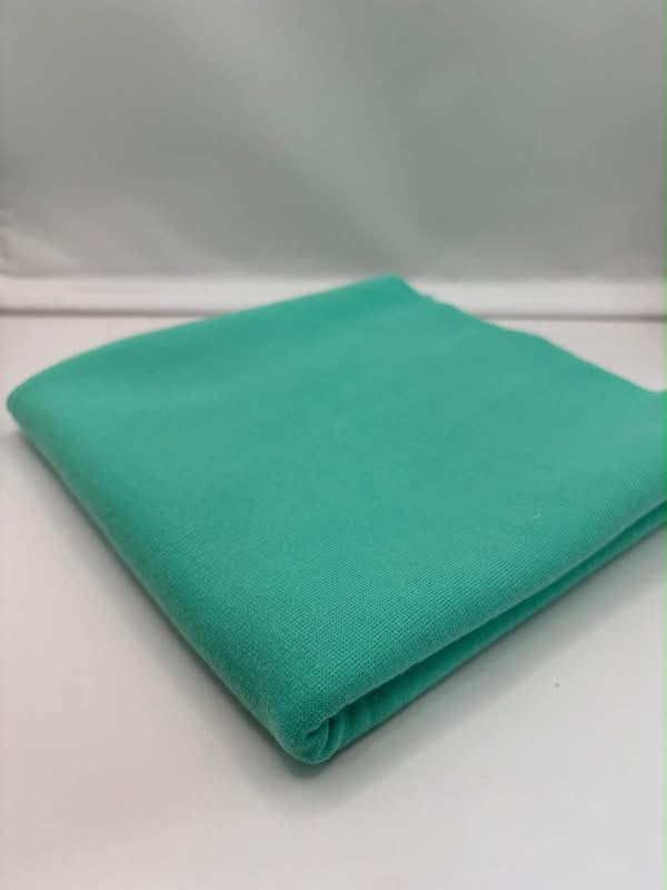Jade Green ponte roma fabric folded