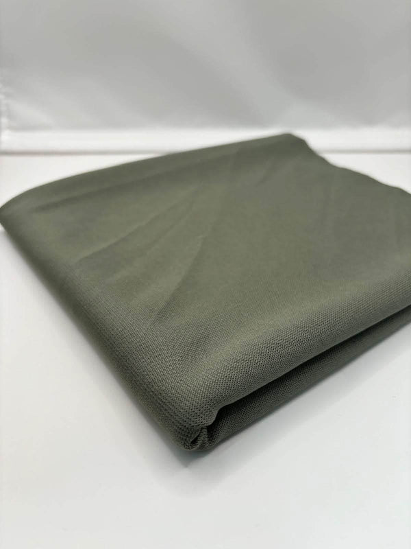 Khaki Green ponte roma fabric folded