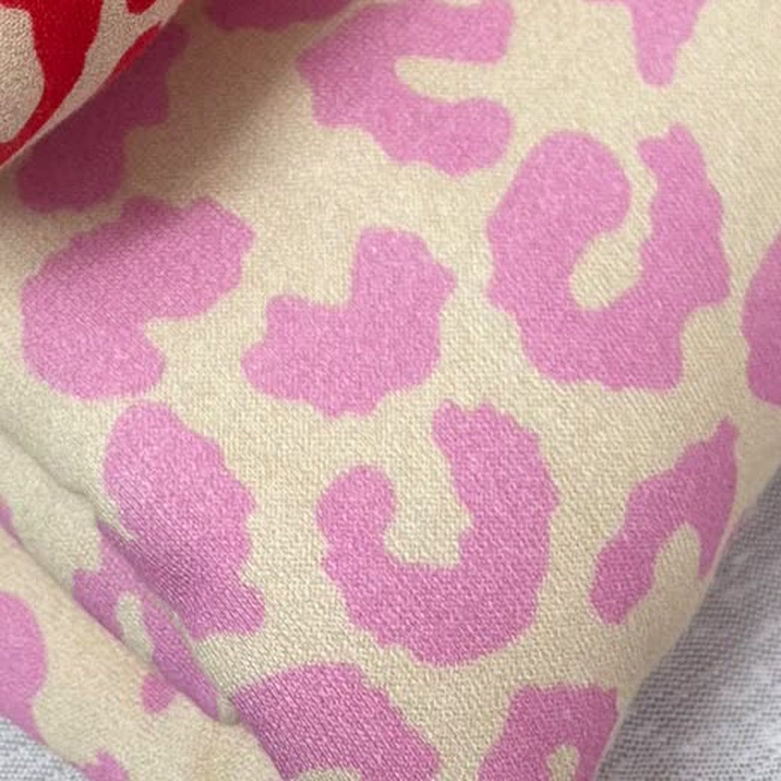 Pink leopard print brushed back fleece jersey fabric