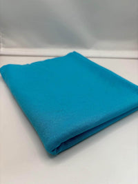 Turquoise ponte roma fabric folded